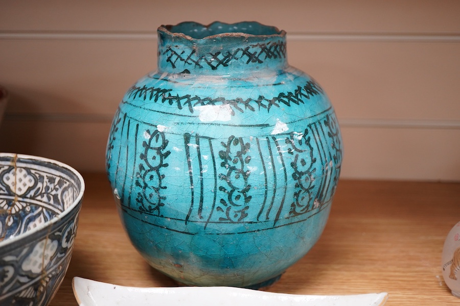 An early Persian pottery bowl and vase, a Japanese bowl and another Chinese segment dish, tallest 20cm